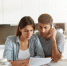 young-couple-checking-their-family-budget_1_1.jpg - GorodnaBire.Ru