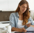 young-woman-checking-her-budget-doing-taxes_1.jpg - GorodnaBire.Ru