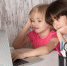 cute-boys-pink-white-t-shirts-using-grey-laptop-table-with-pens-grey-background_1.jpg - GorodnaBire.Ru