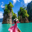 beautiful-girl-standing-boat-looking-mountains-ratchaprapha-dam-khao-sok-national-park-surat-thani-province-thailand_1.jpg - GorodnaBire.Ru