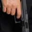 anonymous-man-black-uniform-carrying-shortbarrelled-handgun-firearm-lowered-down-crop-view_1_1.jpg - GorodnaBire.Ru